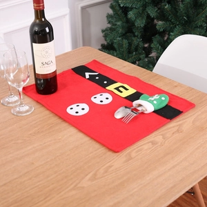 Festive red Christmas placemat with Santa suit design and green glove utensil holder