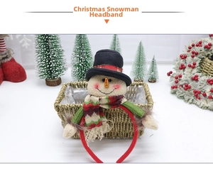 Detailed close-up of a Christmas snowman headband featuring a small hat and scarf