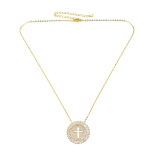 Close-up of gold-plated hollow cross necklace featuring sparkling zircon pave in macro view