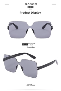 Detail view of oversized rimless sunglasses with integrated nose pads in transparent black