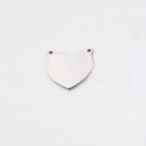 Detail of mirror polished stainless steel heart pendant with dual side holes for DIY jewelry