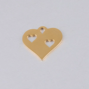 Detail showing the polished golden stainless steel hollow heart charm with three small hearts