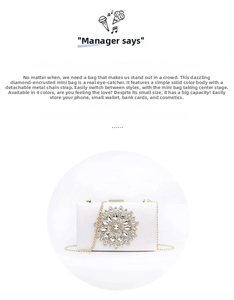 Elegant white evening clutch bag featuring a sparkling rhinestone flower and gold chain strap