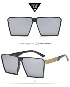 Detail of oversized sunglasses with silver mirror lenses and gold textured metal temples