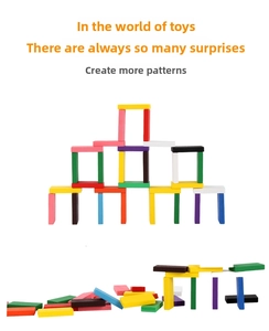 Detailed view of colorful wooden dominoes and blocks stacked in a tower on white background