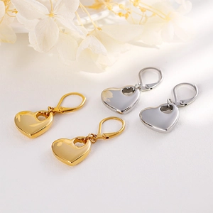 Elegant hollow heart necklace and earrings set in polished gold and silver finishes