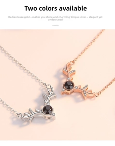 Detail of rose gold and silver deer antler necklaces with projection stones and zircons