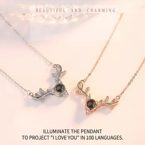 Silver and rose gold elk antler projection necklace featuring 100 languages of I Love You