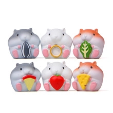 Macro shot of 6 cute hamster figurines holding food items like pizza and strawberry