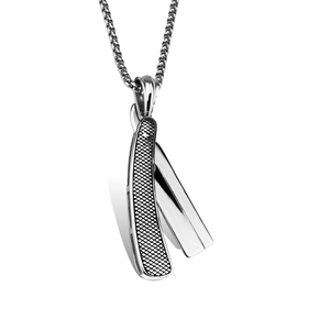 Detailed macro view of a silver razor-shaped stainless steel pendant with mesh textures