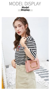 Pink PU crossbody bag featuring unique gold cat-ear handle and slim chain strap
