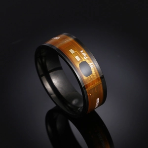 Smart NFC ring in black finish featuring golden circuit board pattern for home automation