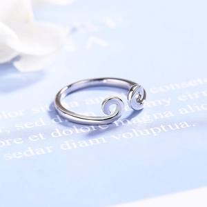 Silver Monkey King open ring with filigree cloud patterns on a blue aesthetic background