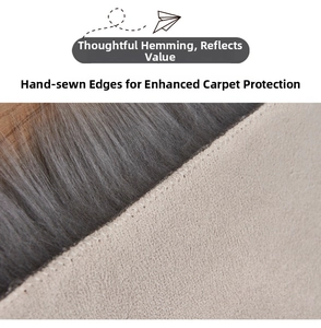 Detail of grey plush rug with non-slip suede backing and durable hand-stitched edges