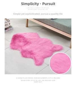 Detailed view of pink shaggy faux sheepskin rug showing plush texture and irregular shape