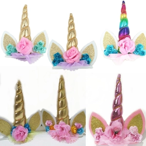 Detailed view of mermaid unicorn horn headbands with glitter ears and fabric flowers