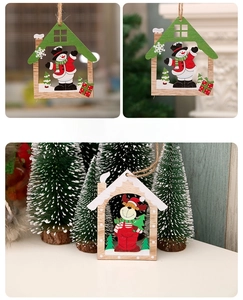 Macro detail of laser-cut wooden Christmas tree ornaments with reindeer and snowman motifs