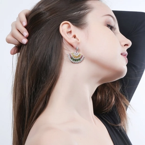 Chic silver fan-shaped earrings with colorful micro-set zircons worn by a model