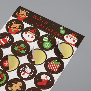 Merry Christmas sticker sheet with Santa Claus and reindeer designs on adhesive labels
