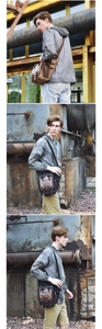 Detail of durable canvas messenger bags in brown and grey with leather trim accents