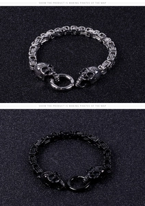 Detail of silver and black skull bracelets featuring braided stainless steel chains