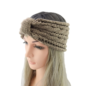 Macro view of brown chunky knit headband featuring a retro twisted texture design