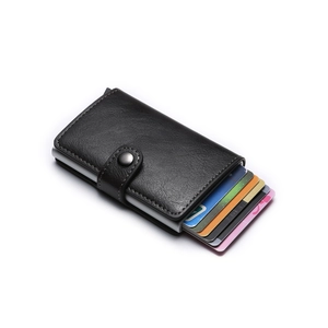 Detail of black PU leather card holder with automatic pop-up aluminum wallet mechanism