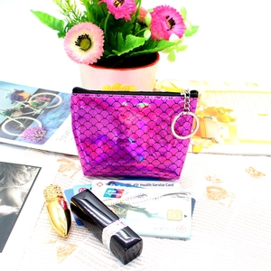 Detail of purple laser fish scale coin purse with silver keychain and zip closure