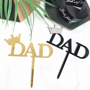 Detail of acrylic DAD cake toppers with glitter crowns for Father's Day decorations