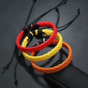 Three minimalist woven PU leather bracelets in red, yellow, and orange with adjustable cords