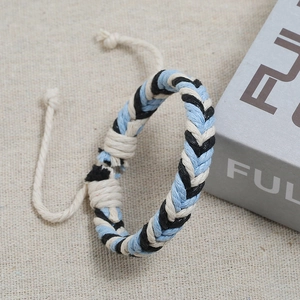 Handmade woven couple bracelet in black, blue and beige with adjustable closure