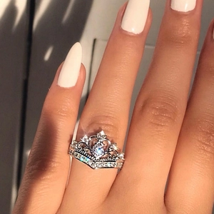 Elegant silver crown ring with brilliant cubic zirconia stones on model hand