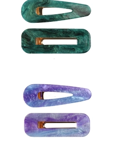 Detail view of acetate marble hair clip set with rectangle and teardrop shapes