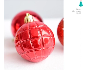 Macro shot of 6cm bright red Christmas ball with diamond texture and gold cap ornament