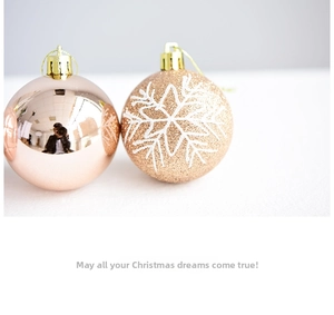 Detailed view of rose gold electroplated and gold glitter snowflake Christmas ornaments