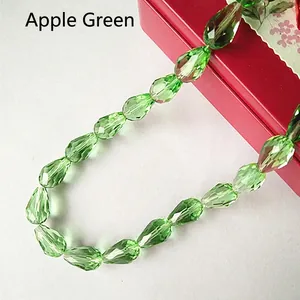 Macro shot of faceted apple green waterdrop glass beads for DIY jewelry making accessories