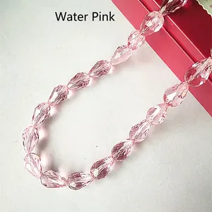 Detail of multi-faceted light pink teardrop crystal beads for DIY jewelry making