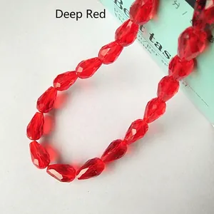 Macro shot of faceted bright red teardrop crystal glass beads for DIY jewelry making