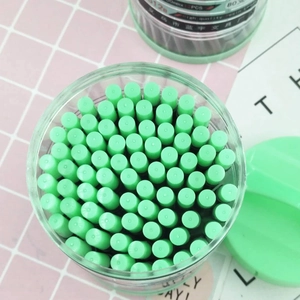 Green 0.5mm automatic pencil lead refills in clear cylindrical storage bottle
