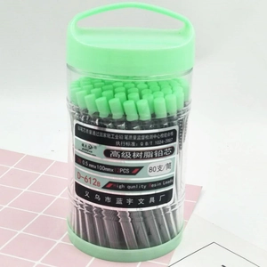 Detailed macro view of 0.5mm 2B resin mechanical pencil leads in a green-capped tube