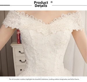 Close-up of white sequined lace detail on an elegant off-the-shoulder wedding dress