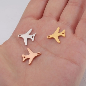 Mirror polished stainless steel airplane pendants in silver, gold, and rose gold colors
