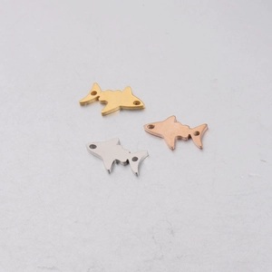 Three shark-shaped stainless steel charms in gold, silver, and rose gold with dual holes