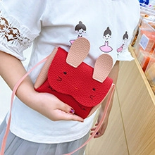 Cute red bunny-shaped shoulder bag for kids with pink ears and crossbody strap