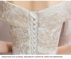 Detail of elegant corset lace-up back with floral embroidery on white bridal gown