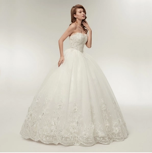 Elegant strapless ball gown wedding dress with sequin bodice and 3D floral lace details