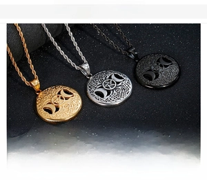 Detail of Viking tree of life and pentagram moon stainless steel pendants in three finishes