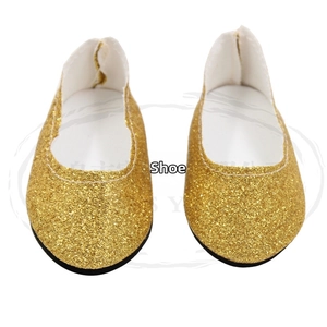 Detailed view of 18 inch doll shoes featuring glittery gold sequins and flat black soles