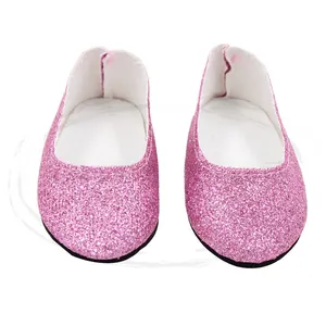 Close-up of pink sequined doll shoes with white lining and black soles for 18 inch dolls