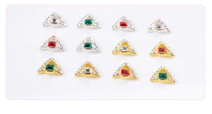 Detailed grid of 3D triangle nail charms with gold and silver bases and crystals